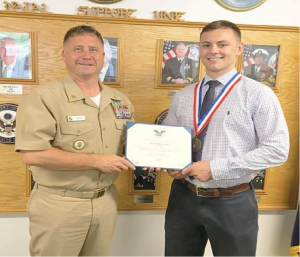 Command Master Chief James Petty (Left) of Naval Support Unit Department of State, Washington, D.C, and Eric Millisor