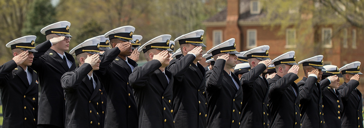 Military personnel salute at Regent University, Virginia Beach.