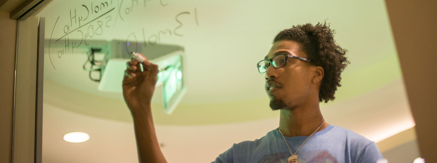 A student performs a calculation at Regent, a premier Christian university with high-ranking undergraduate degree programs.