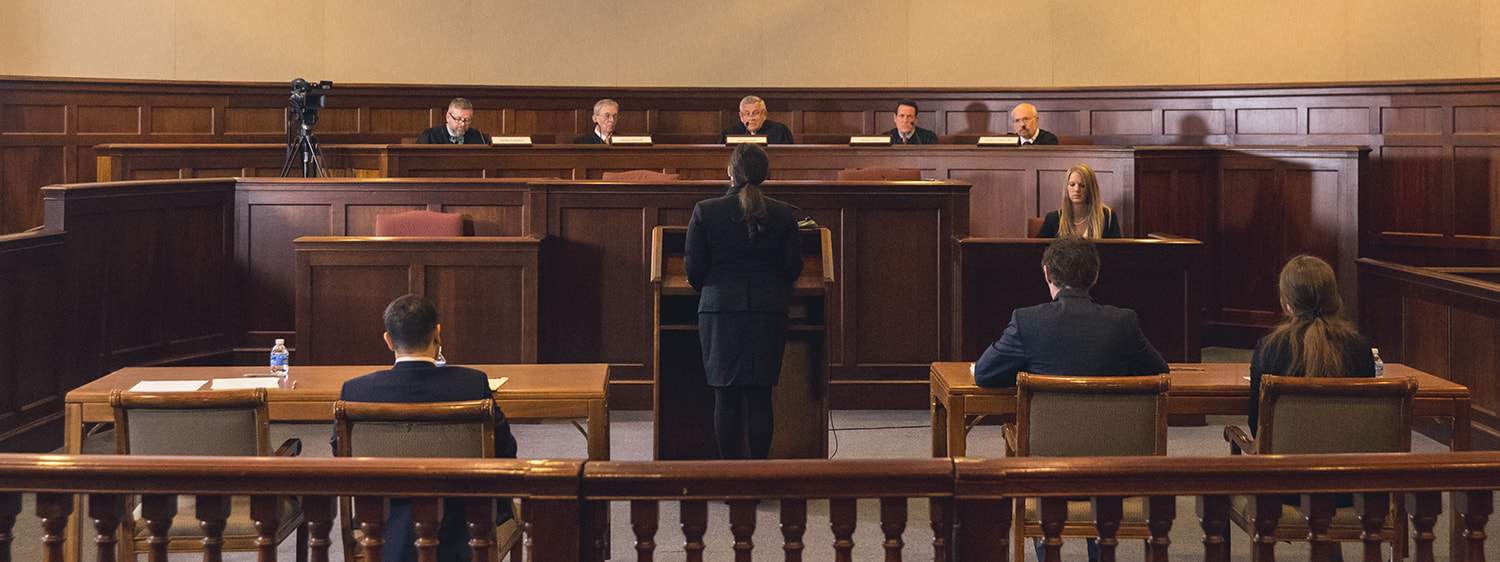 Regent University students in the Master of General Legal Studies online degree in the moot courtroom.