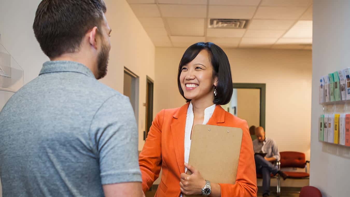 A visitor being greeted: Explore Regent's online PhD in Counseling and Psychological Studies – Life Coaching program.