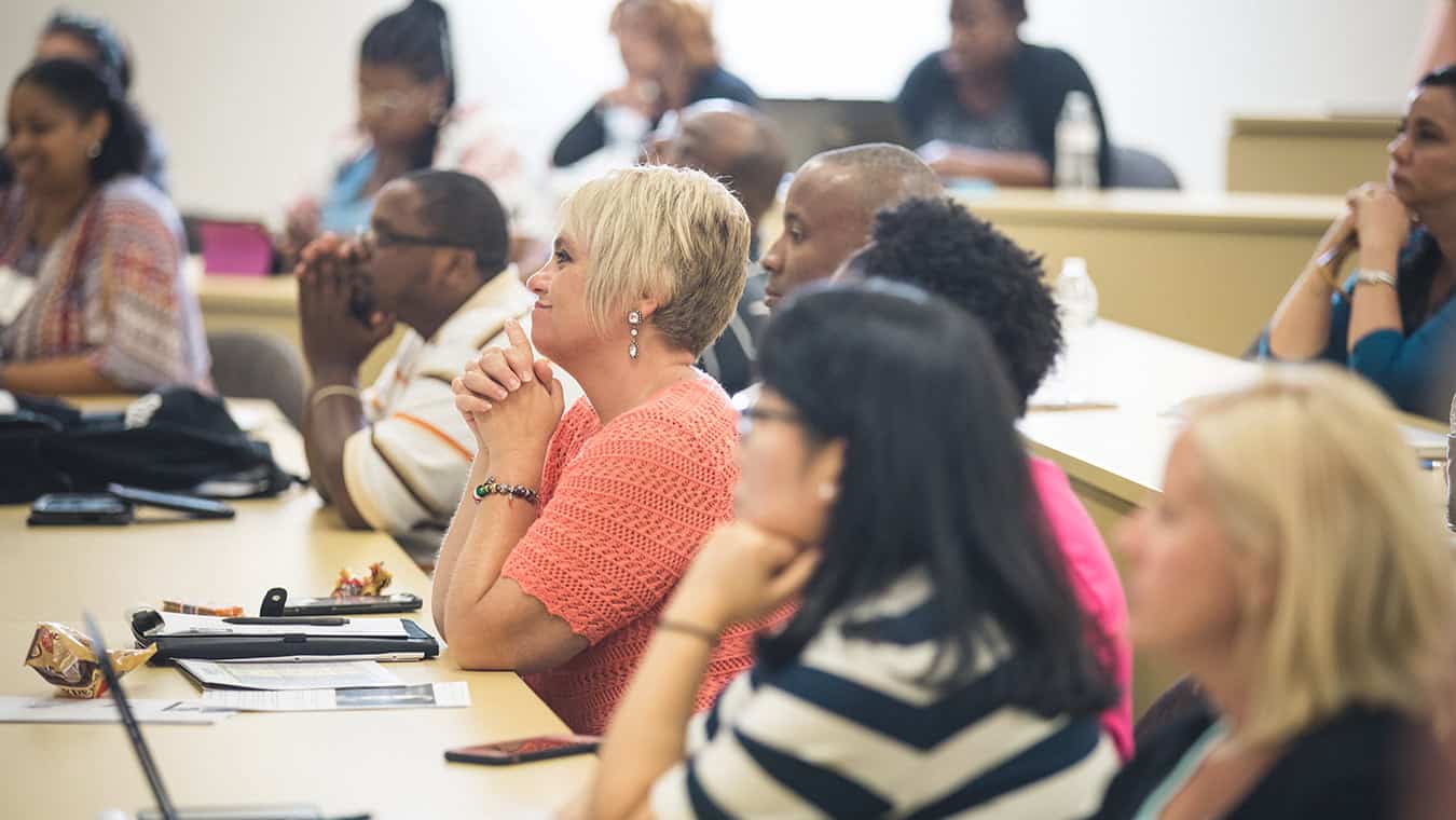 Students in a class: Explore Regent's PhD in Counseling and Psychological Studies – Trauma & Crisis Counseling program.