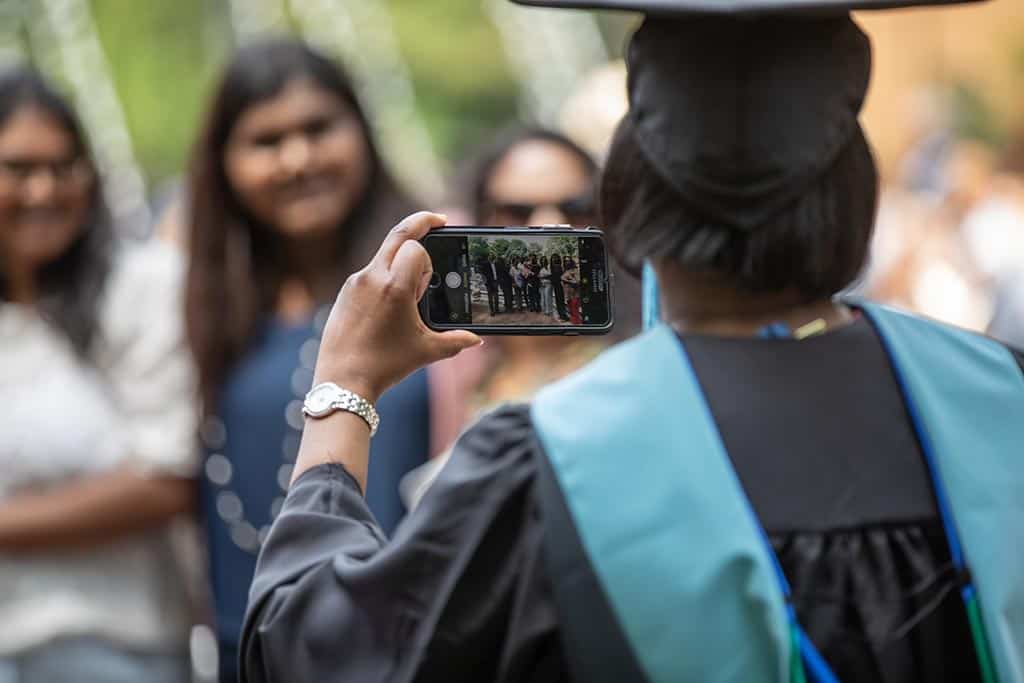 Celebrating a family accomplishment during Regent University’s commencement ceremony.