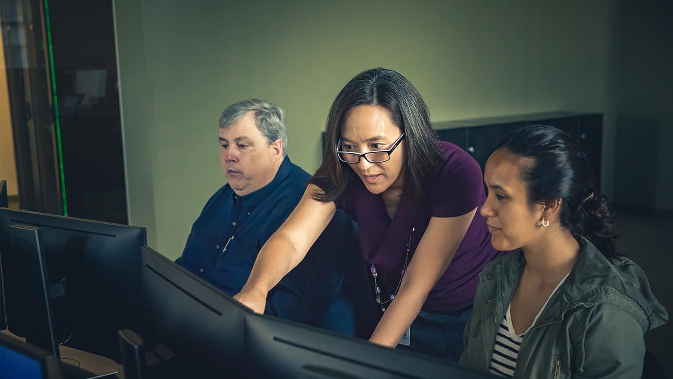 A professor helping a student at Regent University in Virginia Beach.