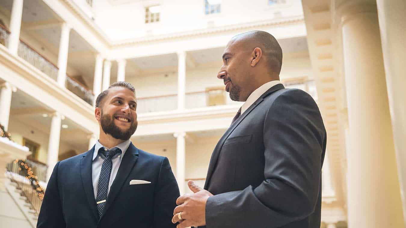 Graduates on campus: Explore the Bachelor of Science in Professional Studies - Government degree program offered by Regent University.