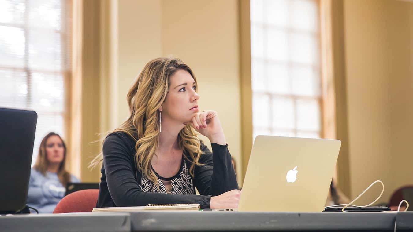 A student in class: Pursue an interdisciplinary graduate program at Regent University.