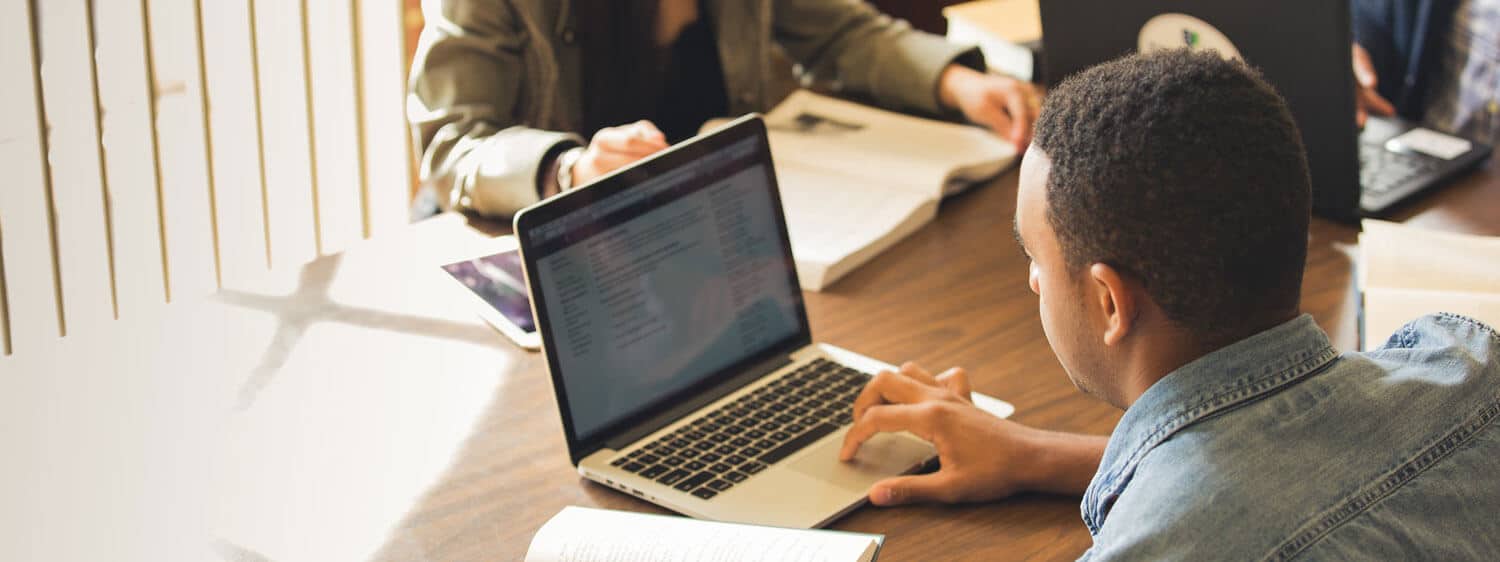 A Regent University student studies online.