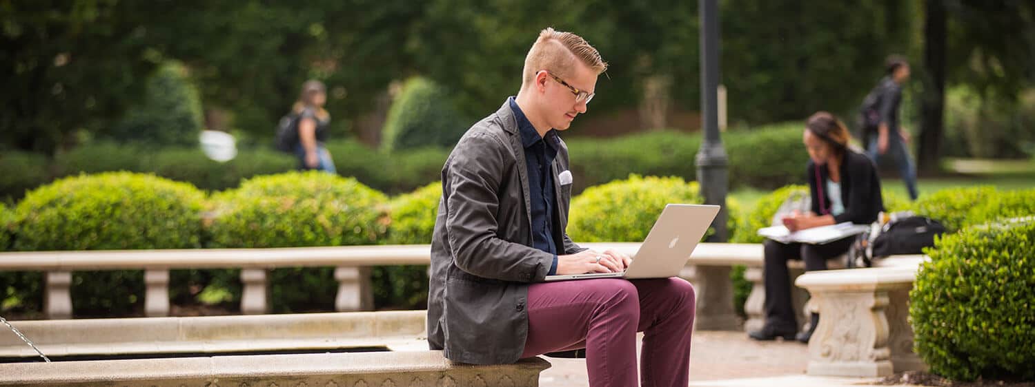 Regent University Student Studying on Laptop