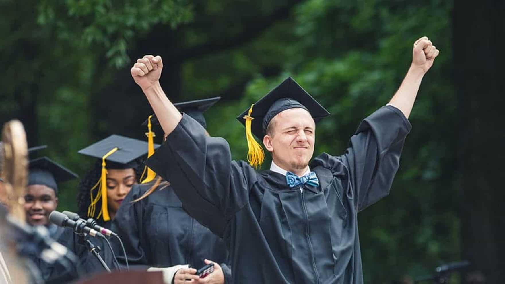 A Regent University graduate exults on commencement day.