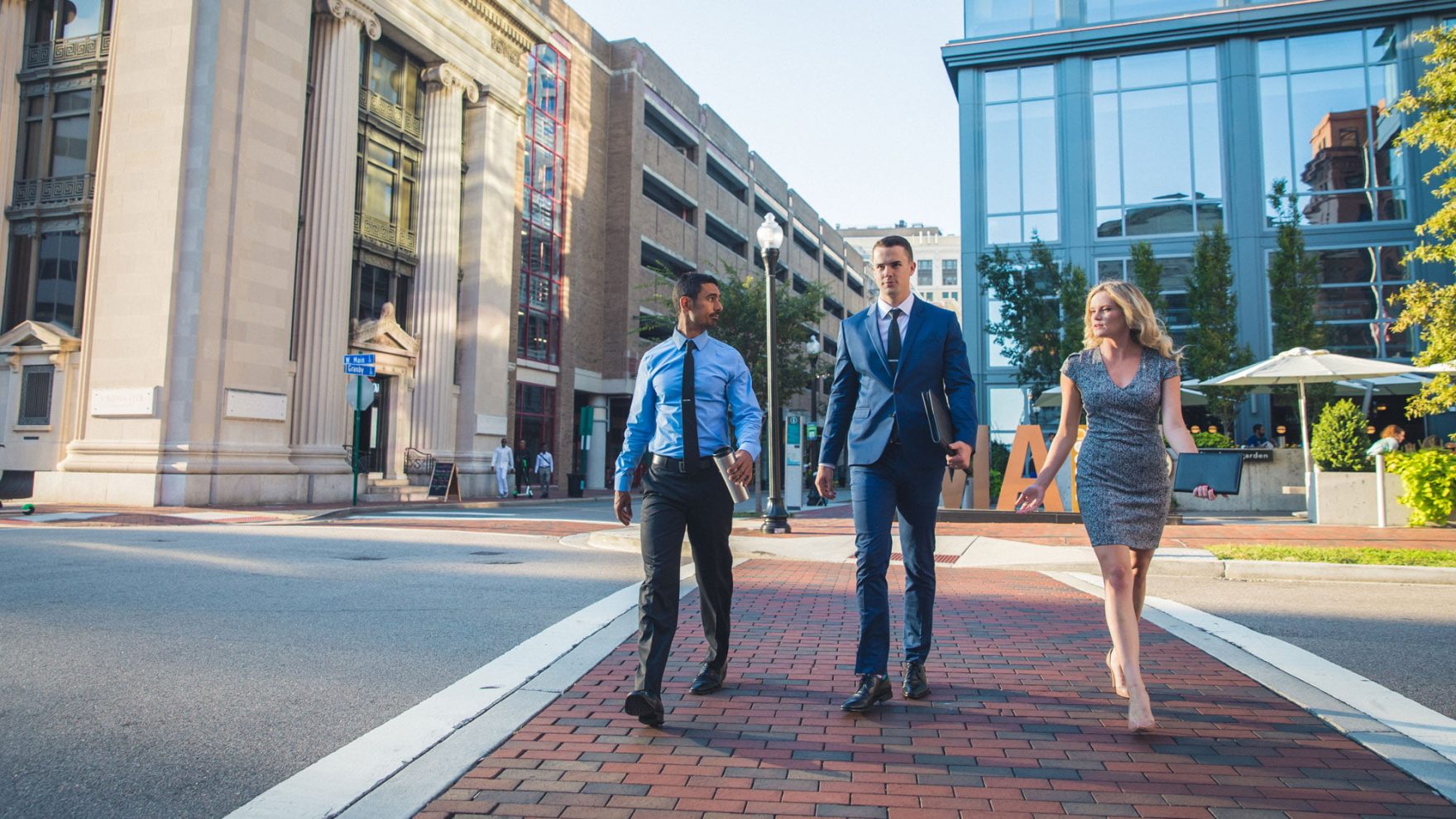 Three professionals walking in Norfolk, Virginia.