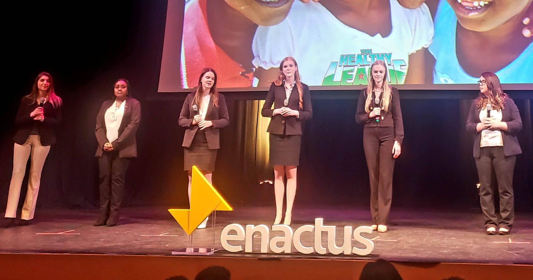 Participants from the Regent University team on stage at the Enactus U.S. National Exposition.