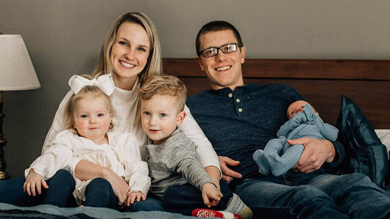 Madison and Joel Simons with their family. 