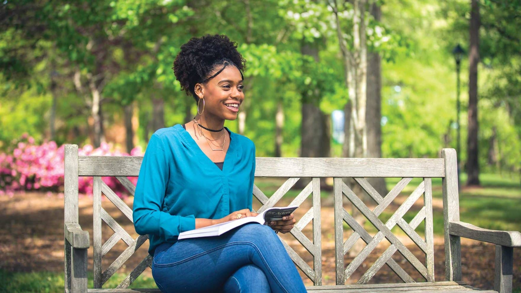 A student reading at Regent: Explore the Humanities Department in the College of Arts & Sciences.