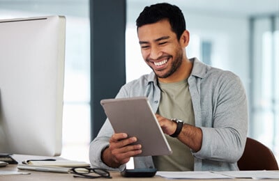 A student using digital tools available from the life coaching resources at Regent University, a Christian college in Virginia Beach.