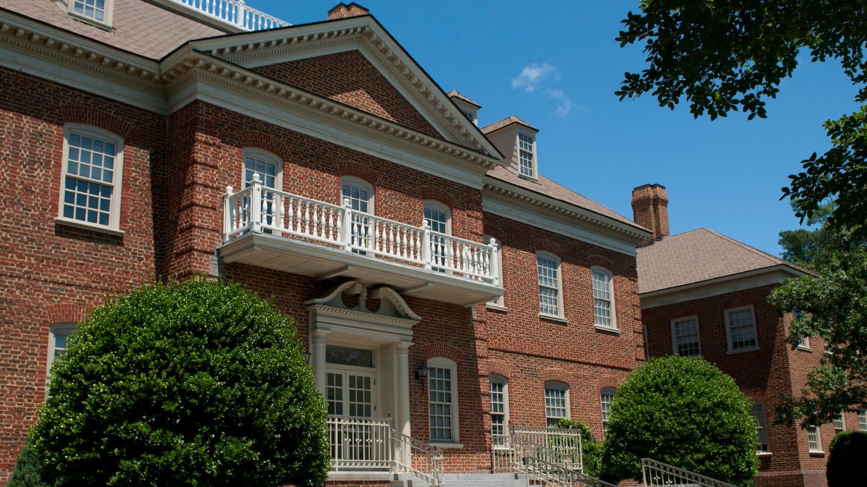 a brick building with a balcony at Regent University