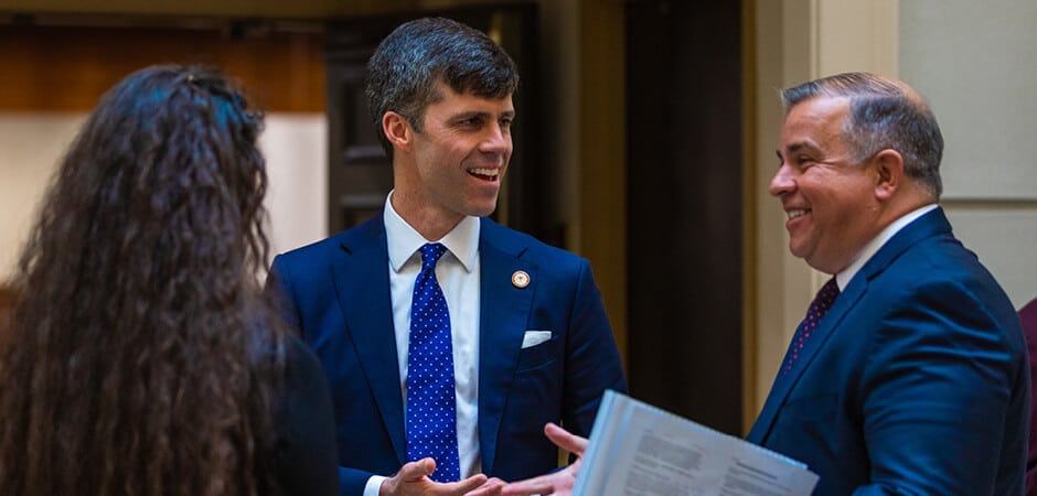 Mississippi Solicitor General Stewart and Dean Lingo chat with a Regent law school student.