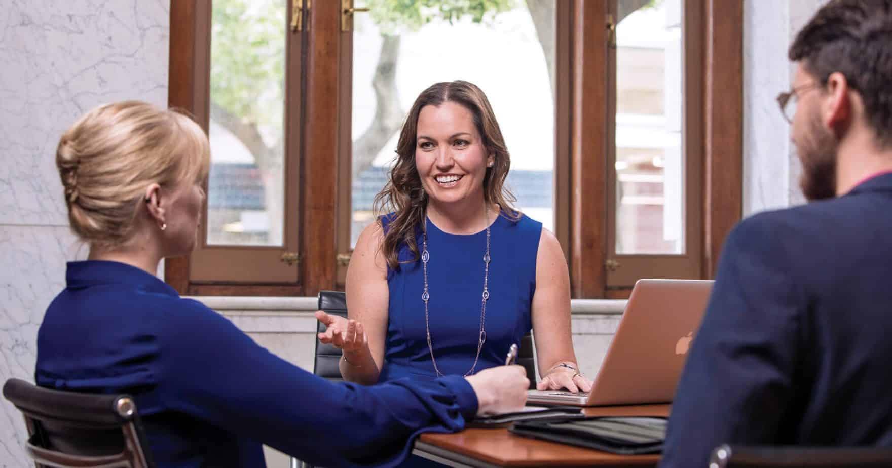 Alumni of Regent University having a discussion, which has been ranked among the top 10 for best master's in human services by Intelligent.com, 2023.