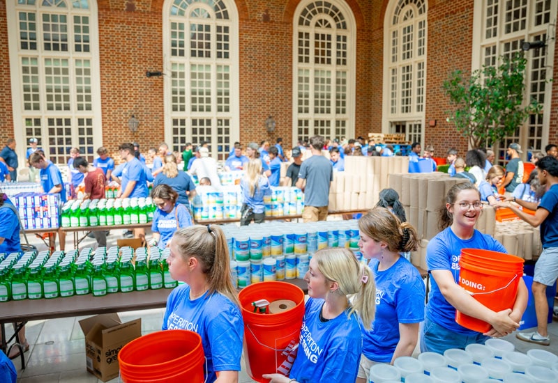 Regent Students and Operation Blessing pack disaster relief kits for Hurricane Idalia victims