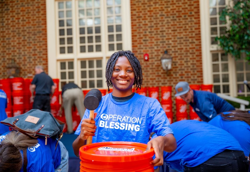 Regent Students and Operation Blessing pack disaster relief kits for Hurricane Idalia victims