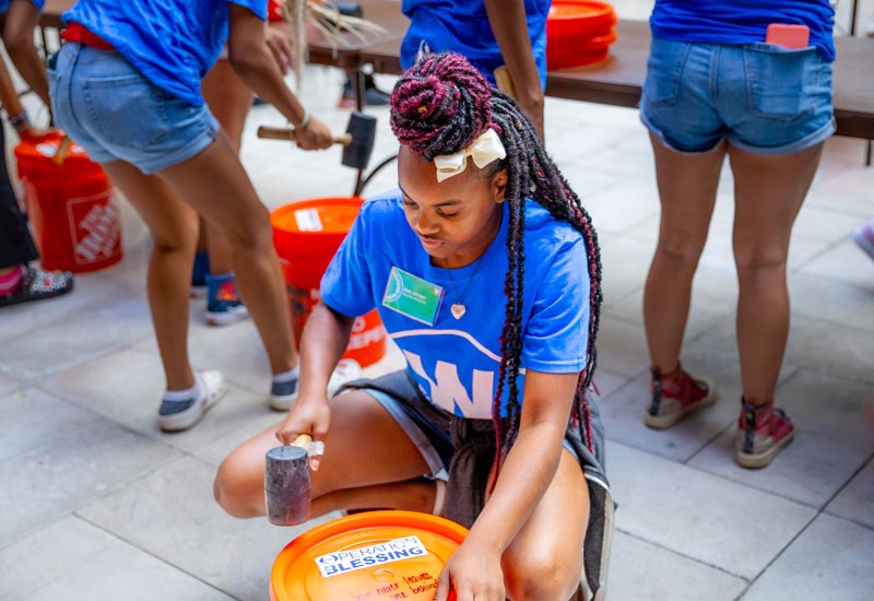 Regent Students and Operation Blessing pack disaster relief kits for Hurricane Idalia victims