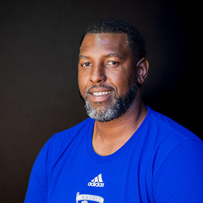 Headshot of Regent University's women's head basketball coach Donte Minter.