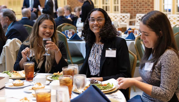 Alumni eating at a banquet at Regent University.  