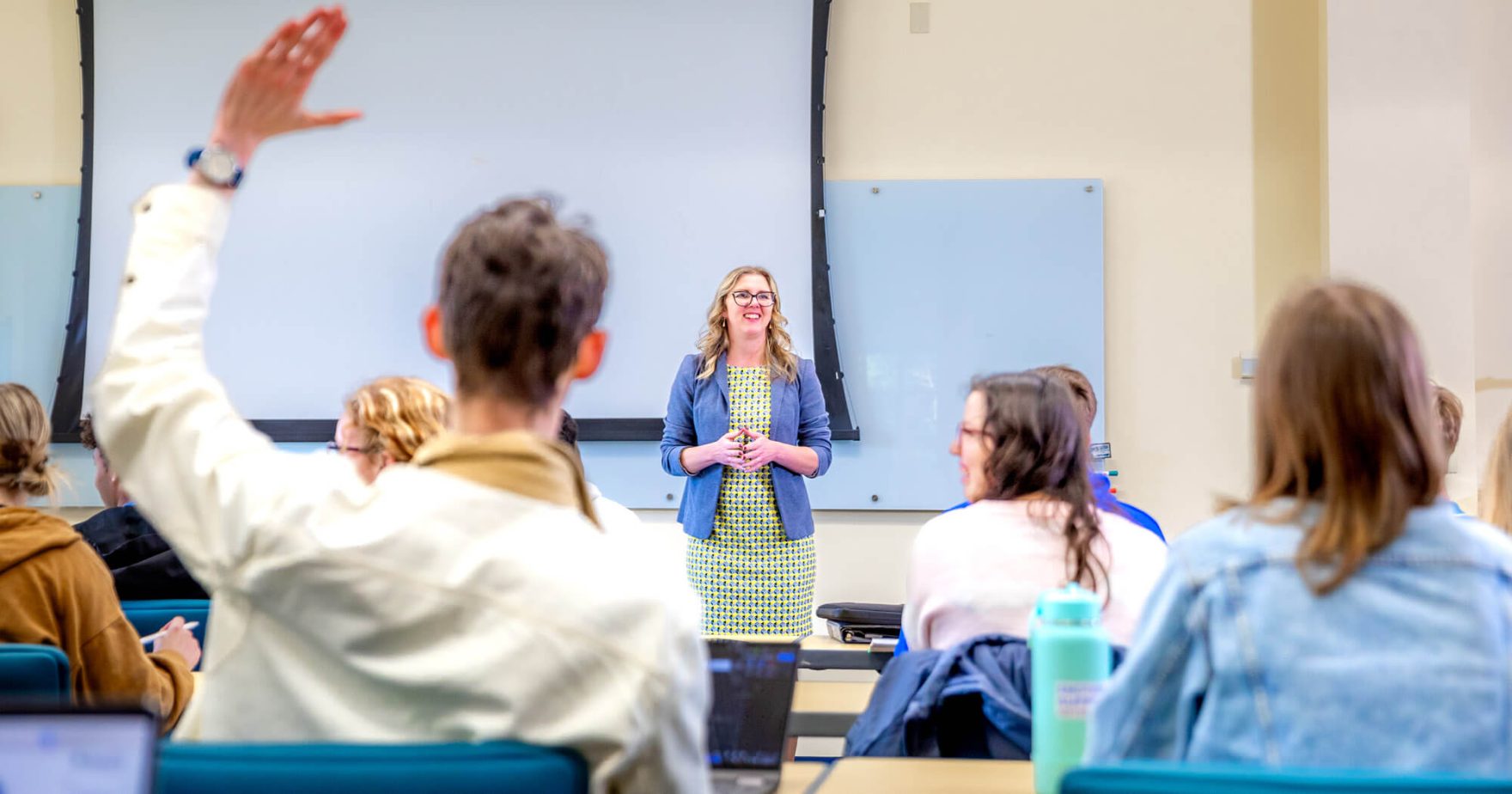 One of Regent University's 21 new faculty members teaching in a Virginia Beach campus classroom.